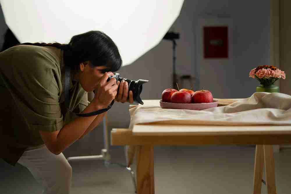 a photographer taking clicking subject